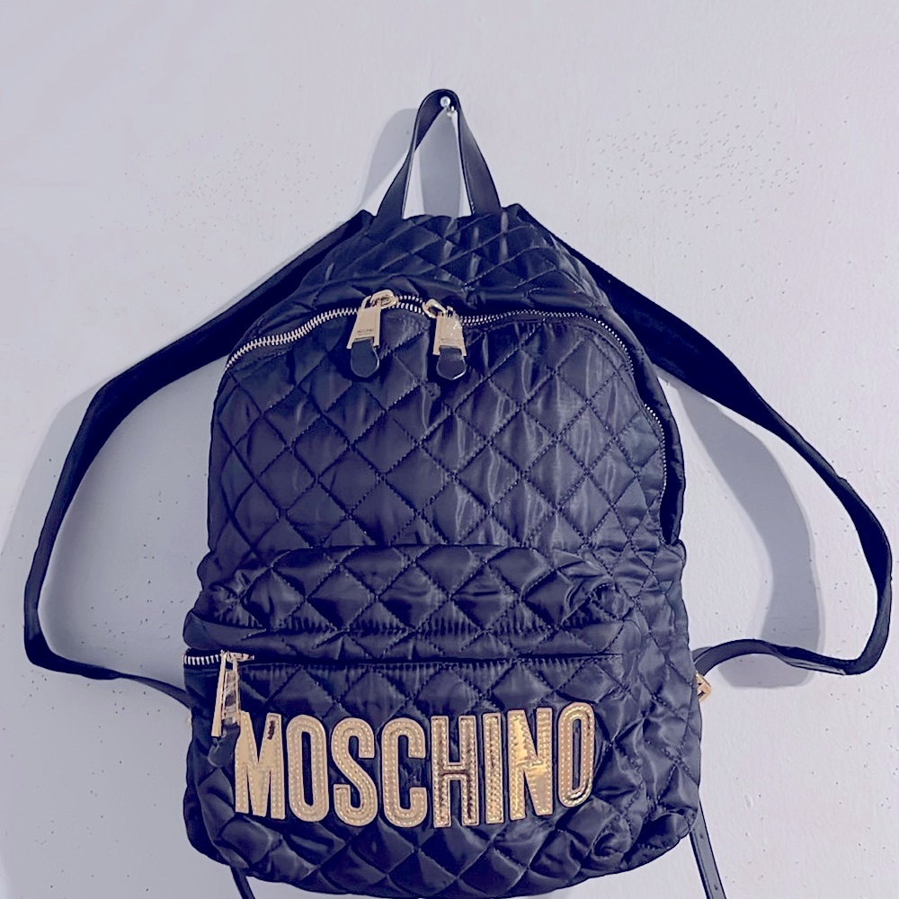 Moschino black embossed backpack with zipper & pocket to front of bag